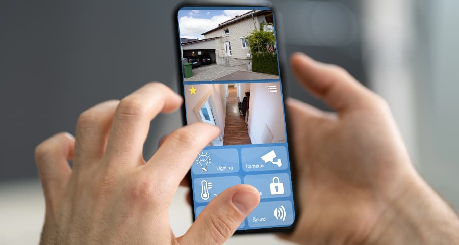 Homeowner checking surveillance camera footage on a cell phone